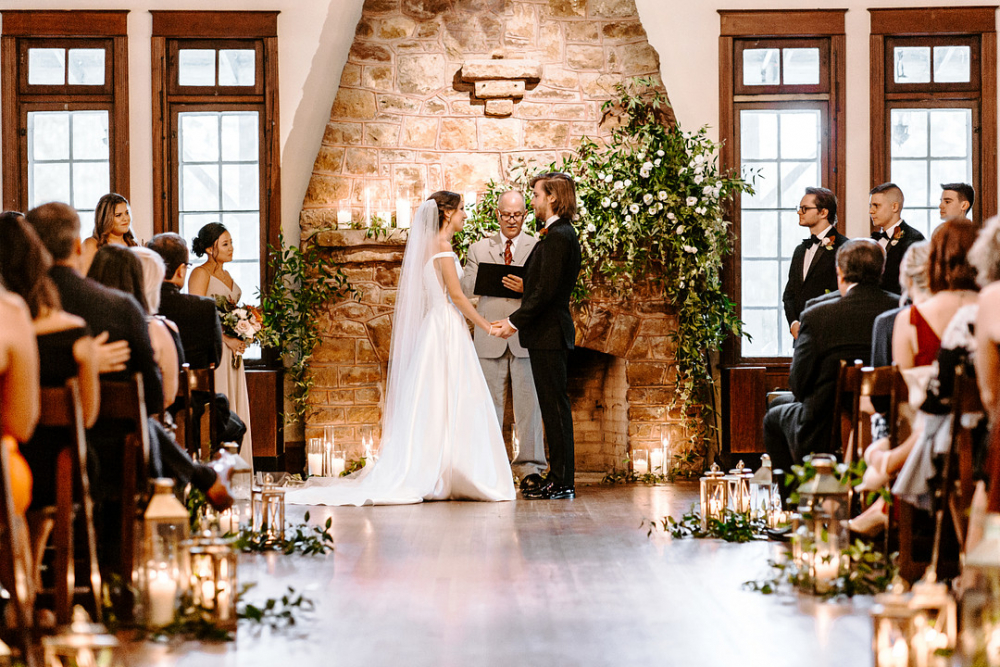 Couple getting married at the alter, rustic lodge style