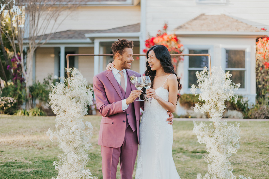 Married couple cheering with champagne