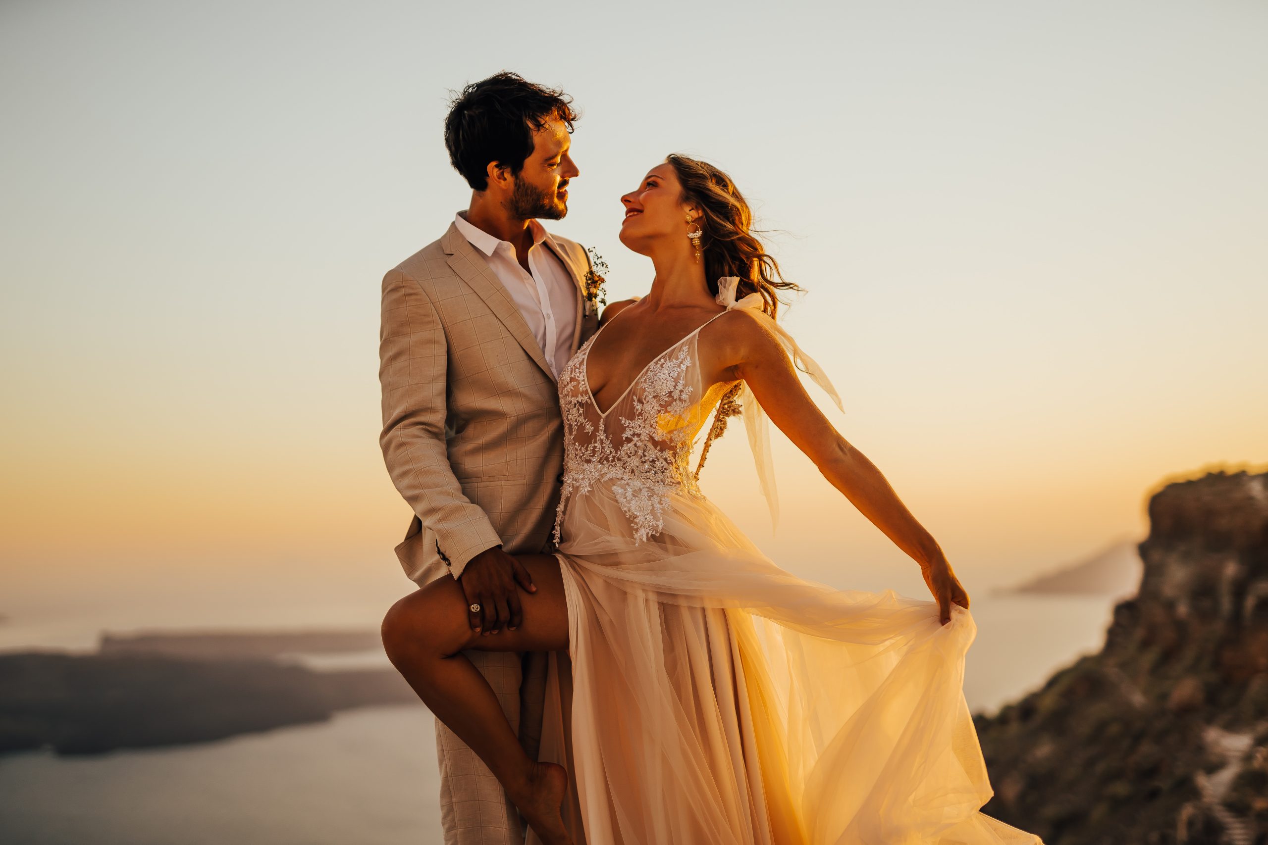 Couple standing on top of a building in Greece