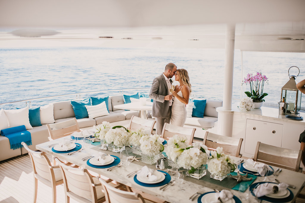 couple dancing on yacht at reception 