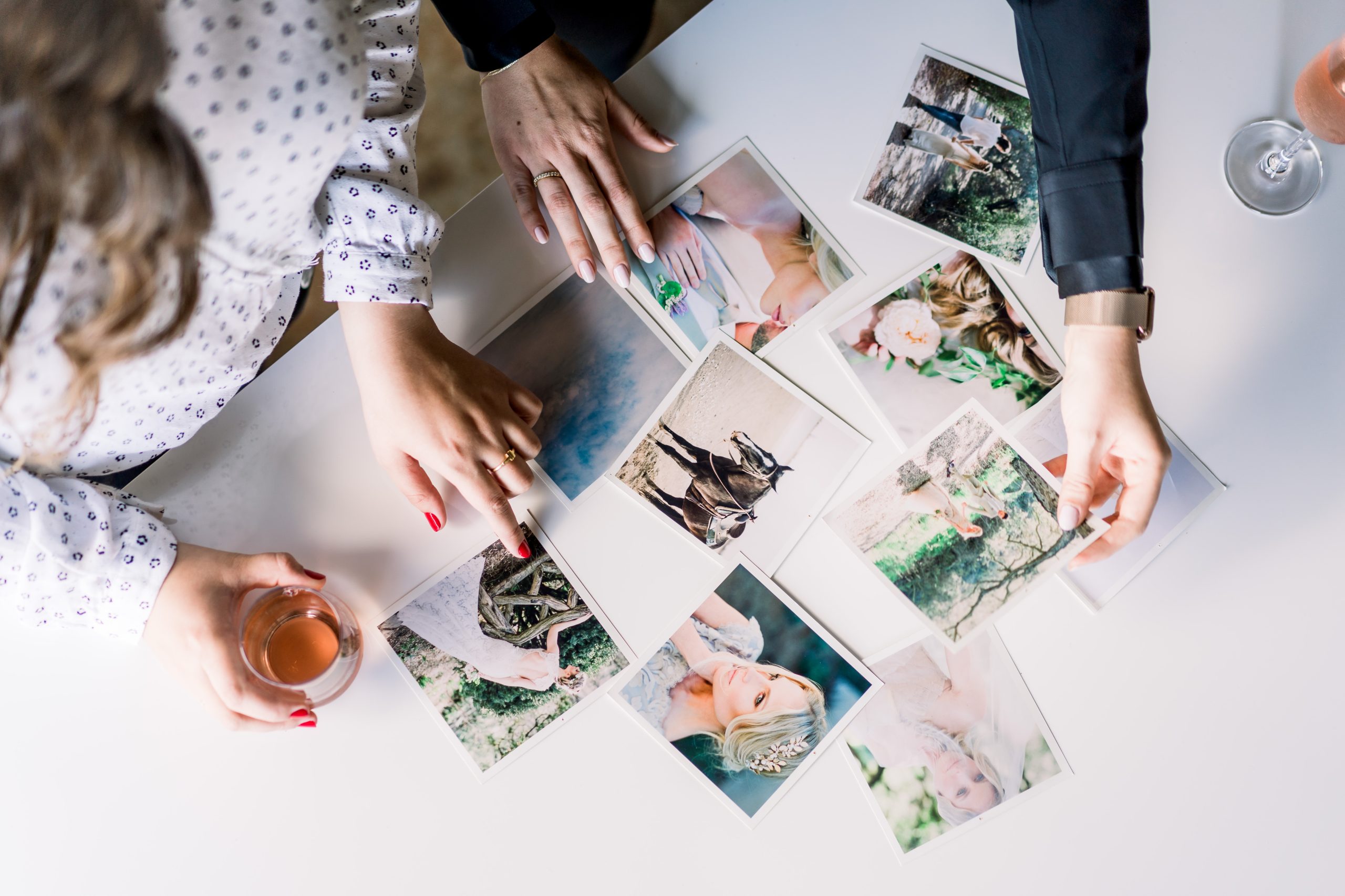 Two people looking at pictures 