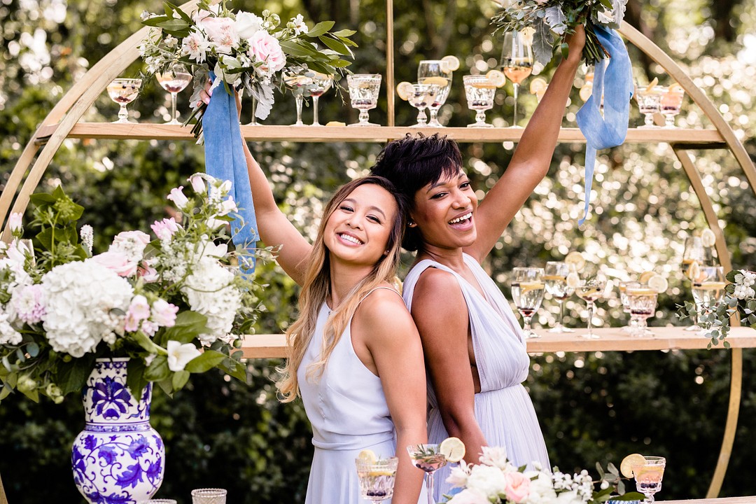 Two people cheering with florals 