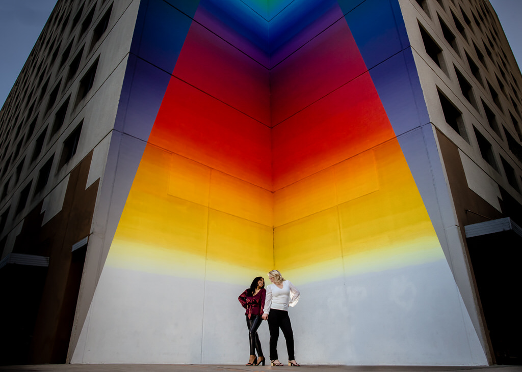 Bright colorful wall and LGBTQ couple
