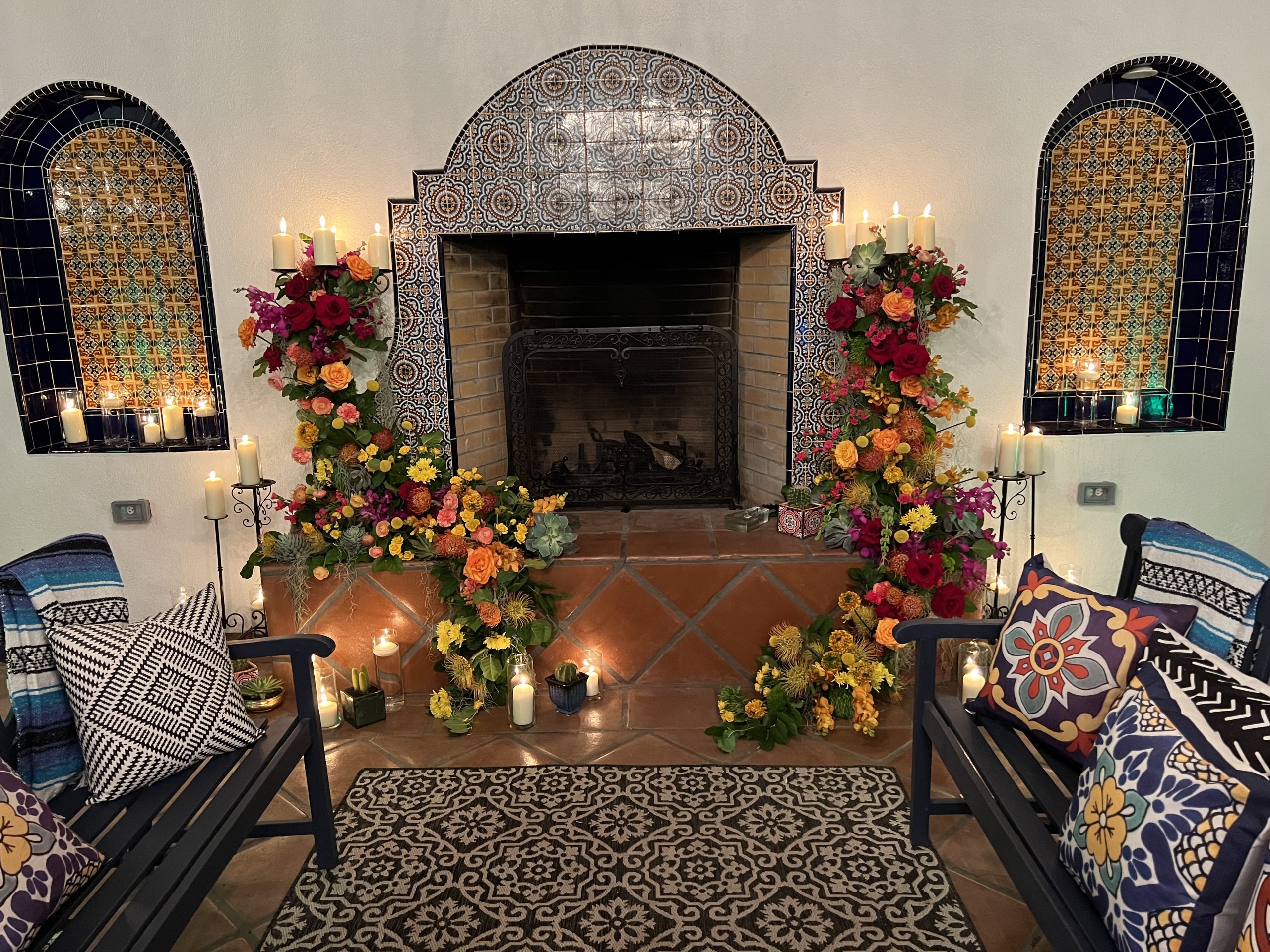 Spanish style fireplace with flowers
