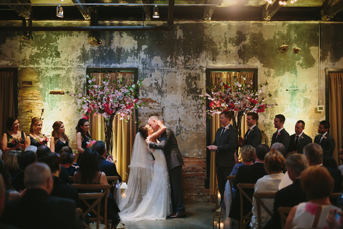 couple kissing at ceremony 