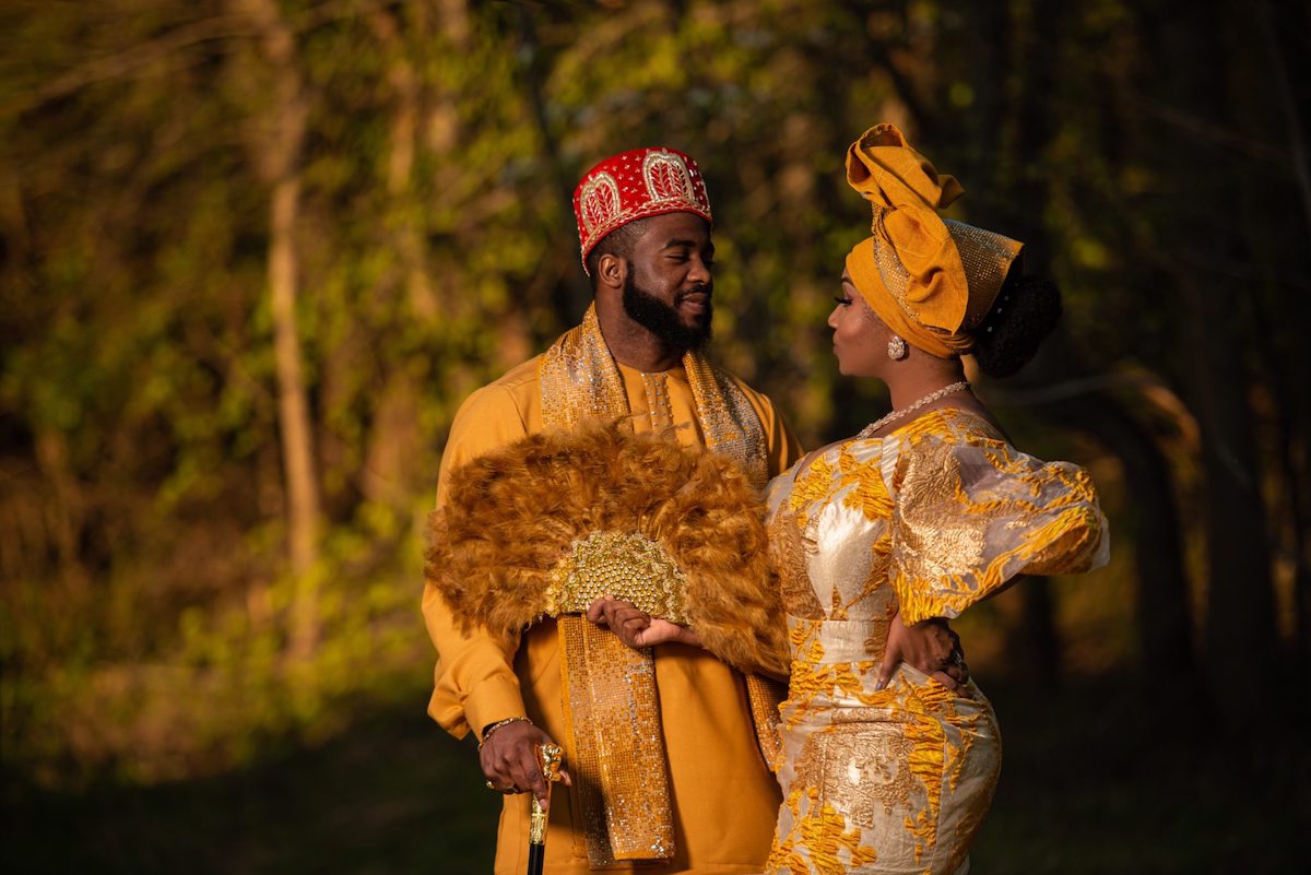 couple in golden colored traditional Nigerian wedding garb 