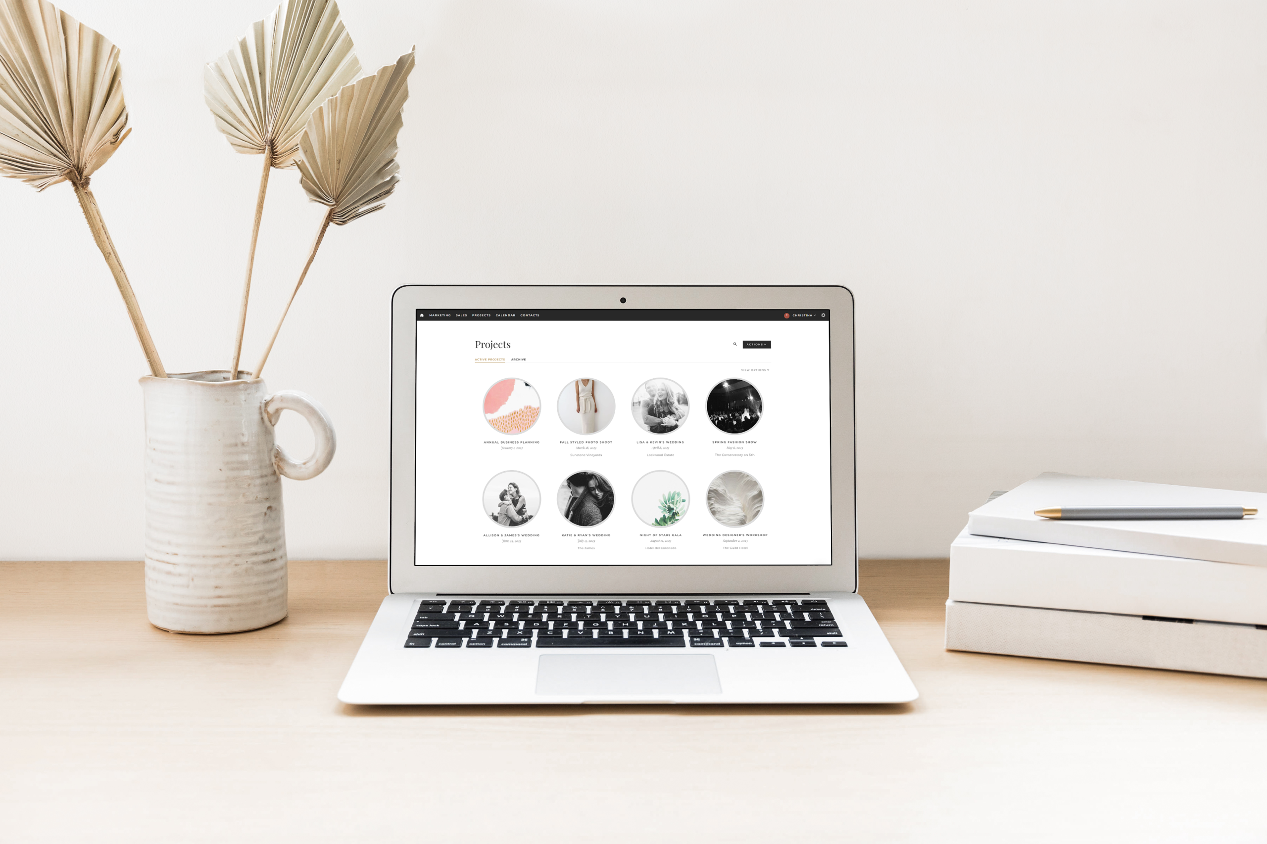 Project Index on a laptop with dry florals next to it