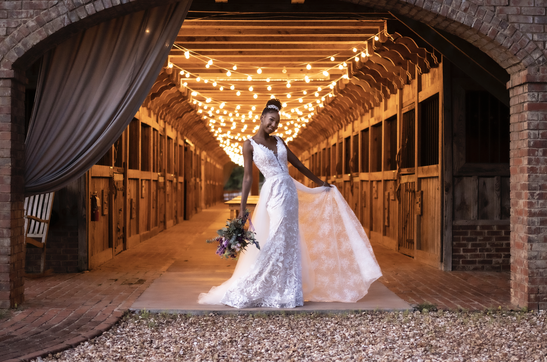 Bride in front of lights in a farm