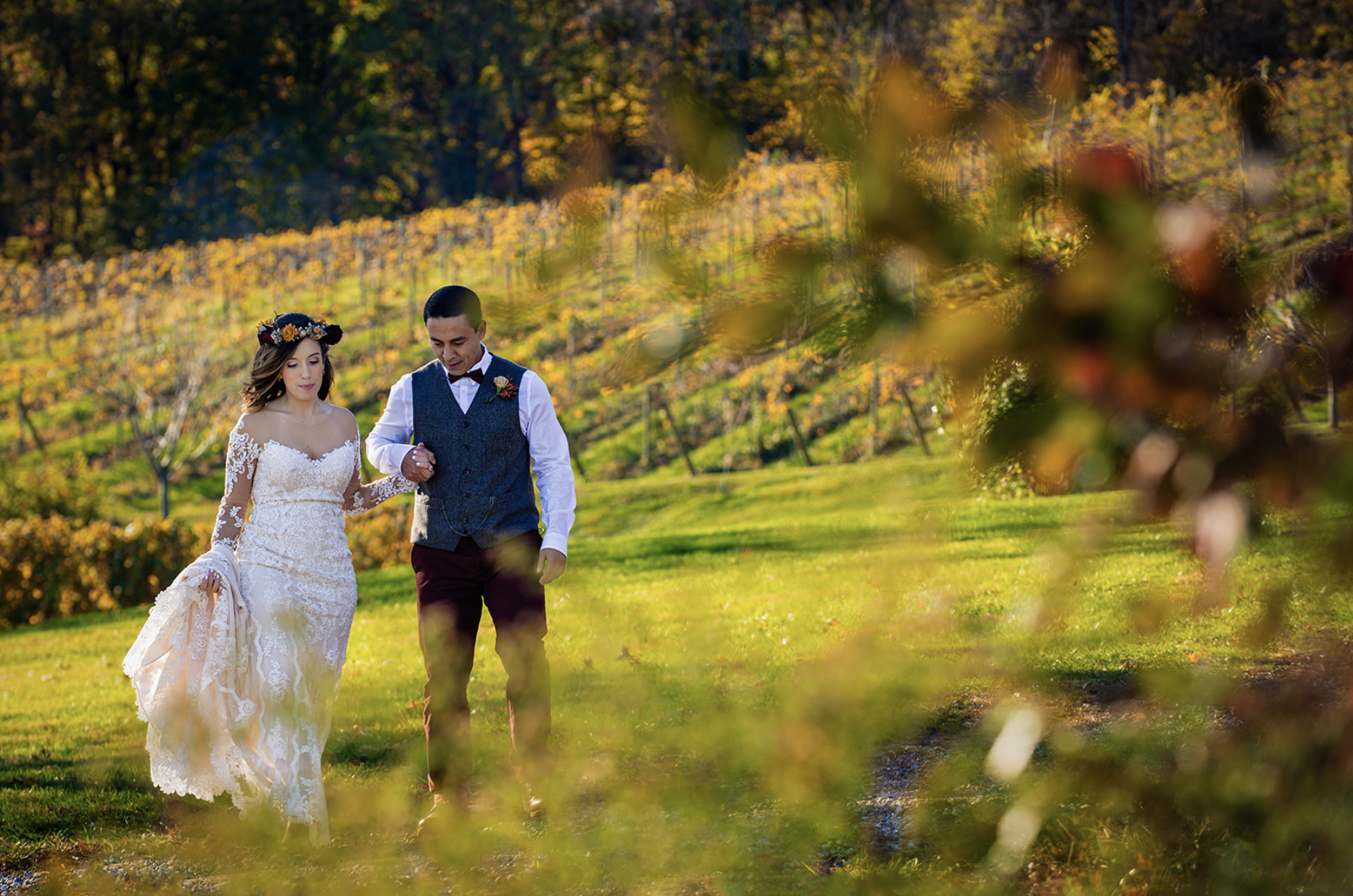 Couple walking through vineyard