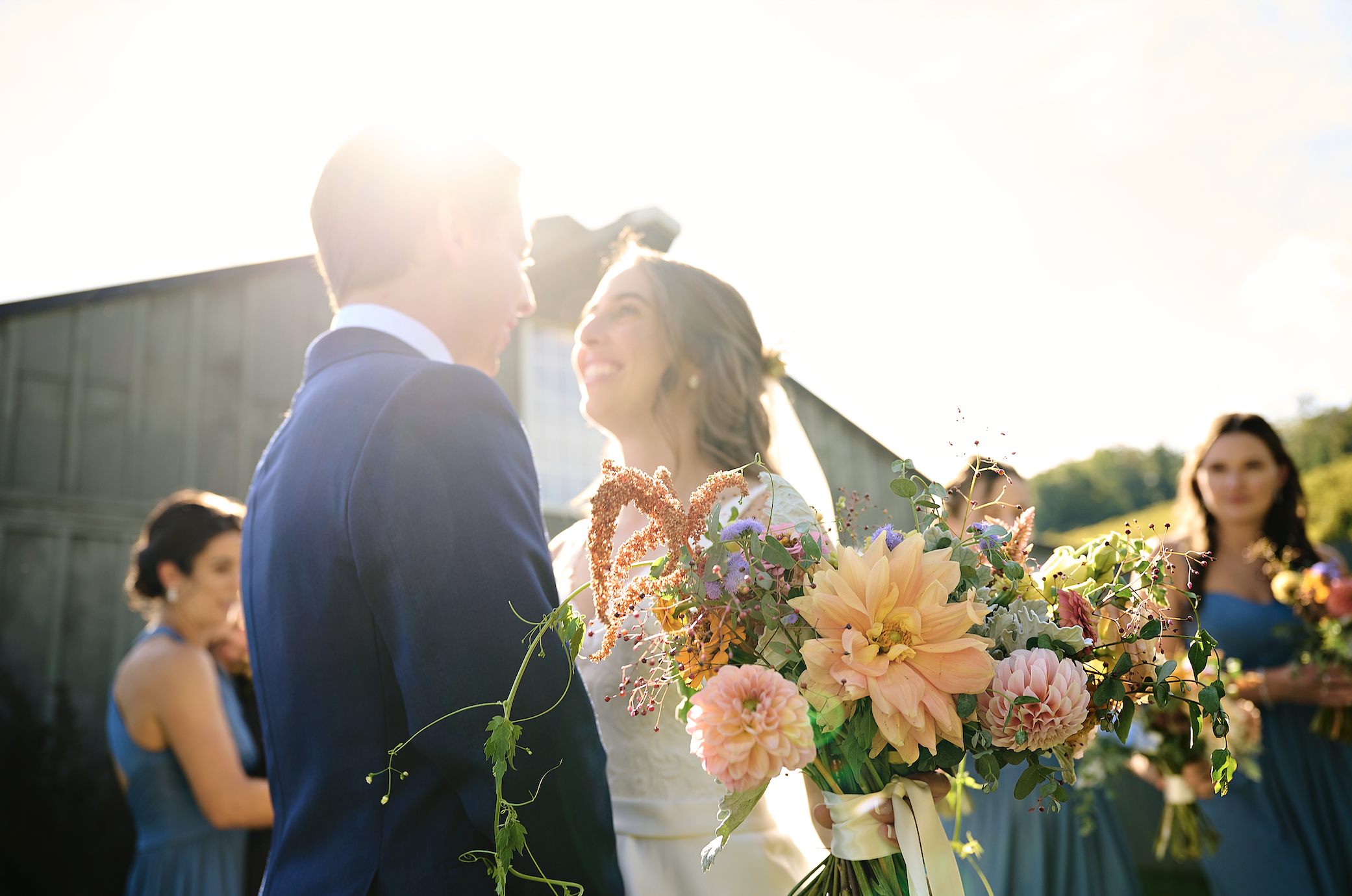 Lowell and her husband looking at each other, bright sunlight