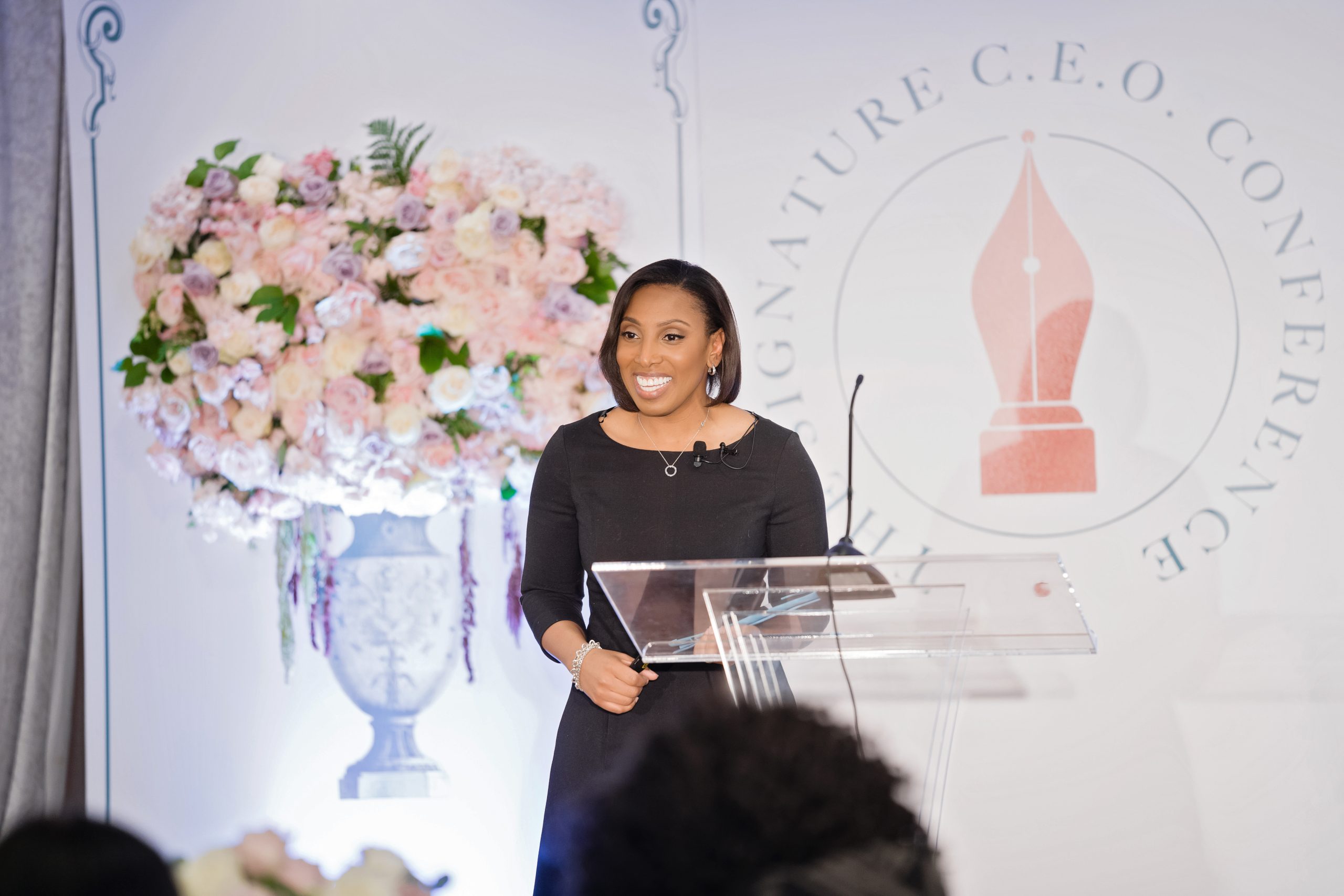 Myra speaking to an audience 