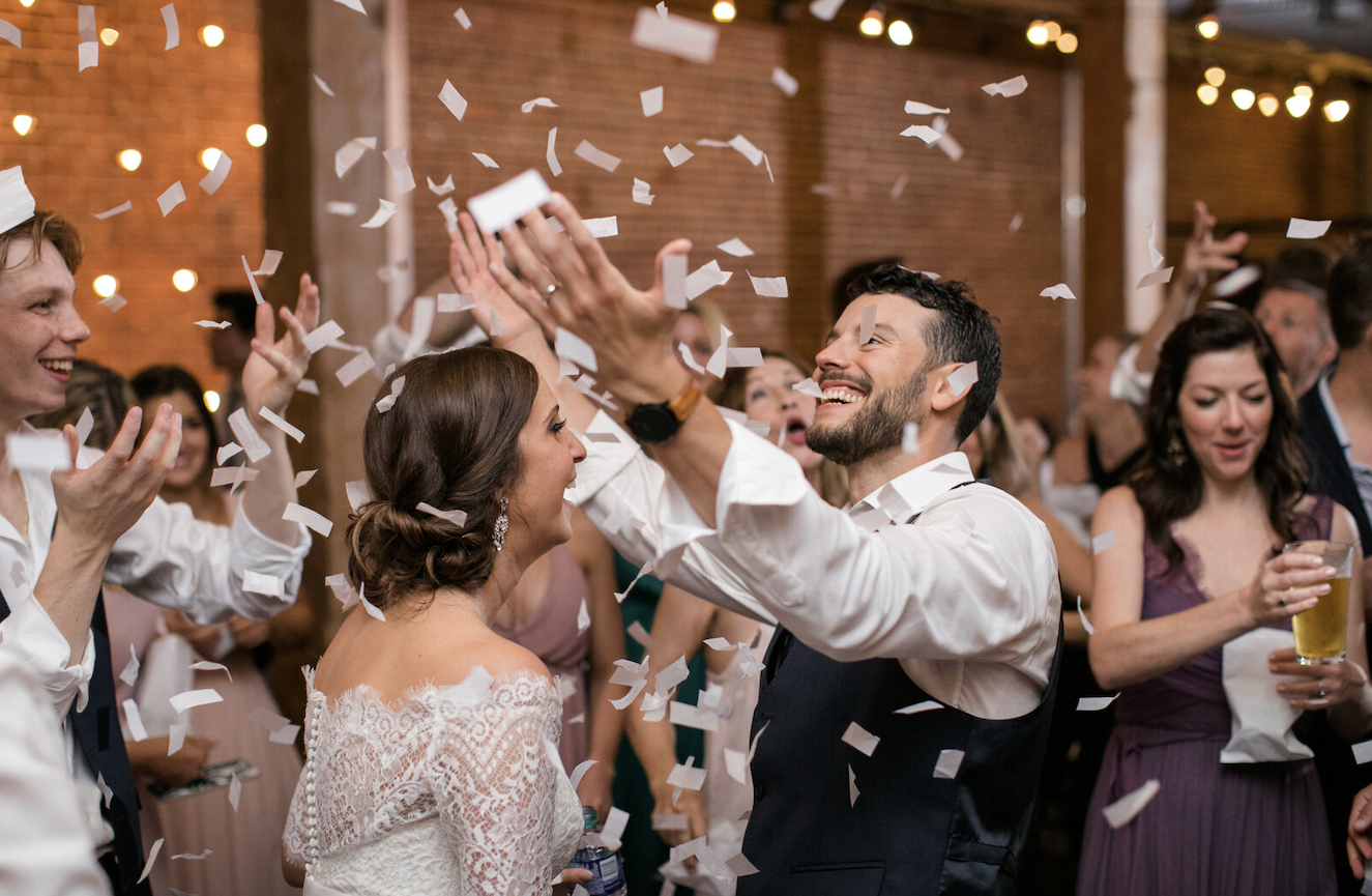 Couple throwing confetti 