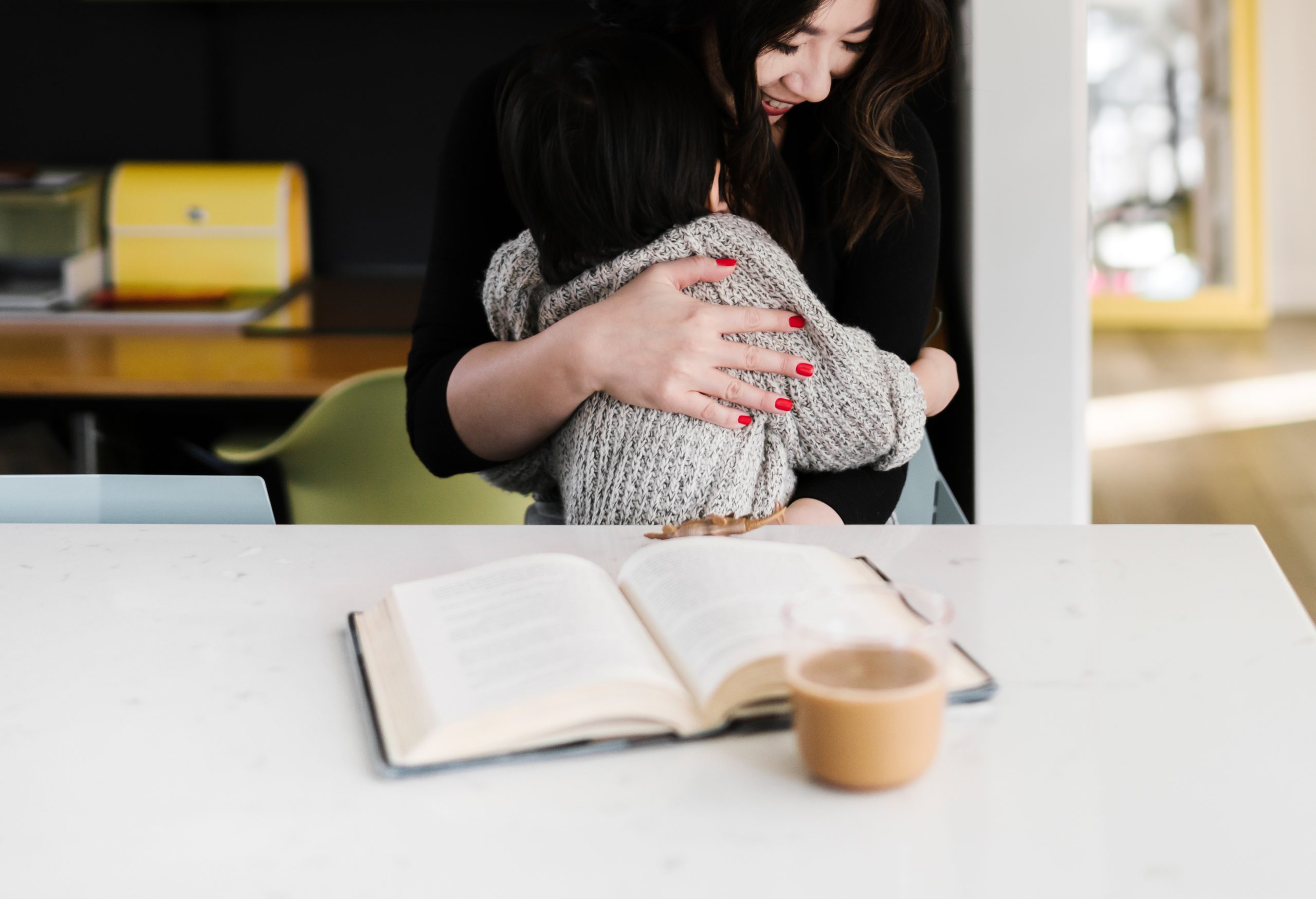 Parent hugging a child