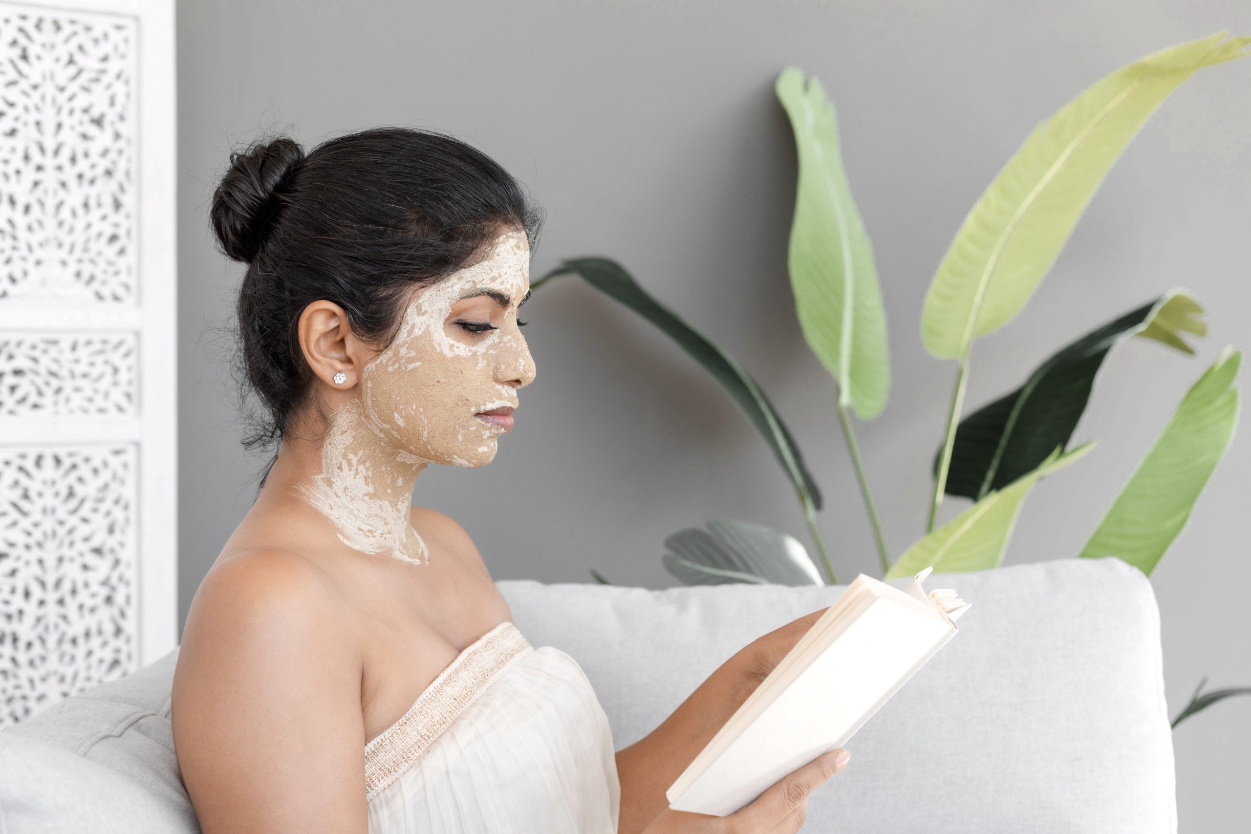 Woman wearing a face mask and reading