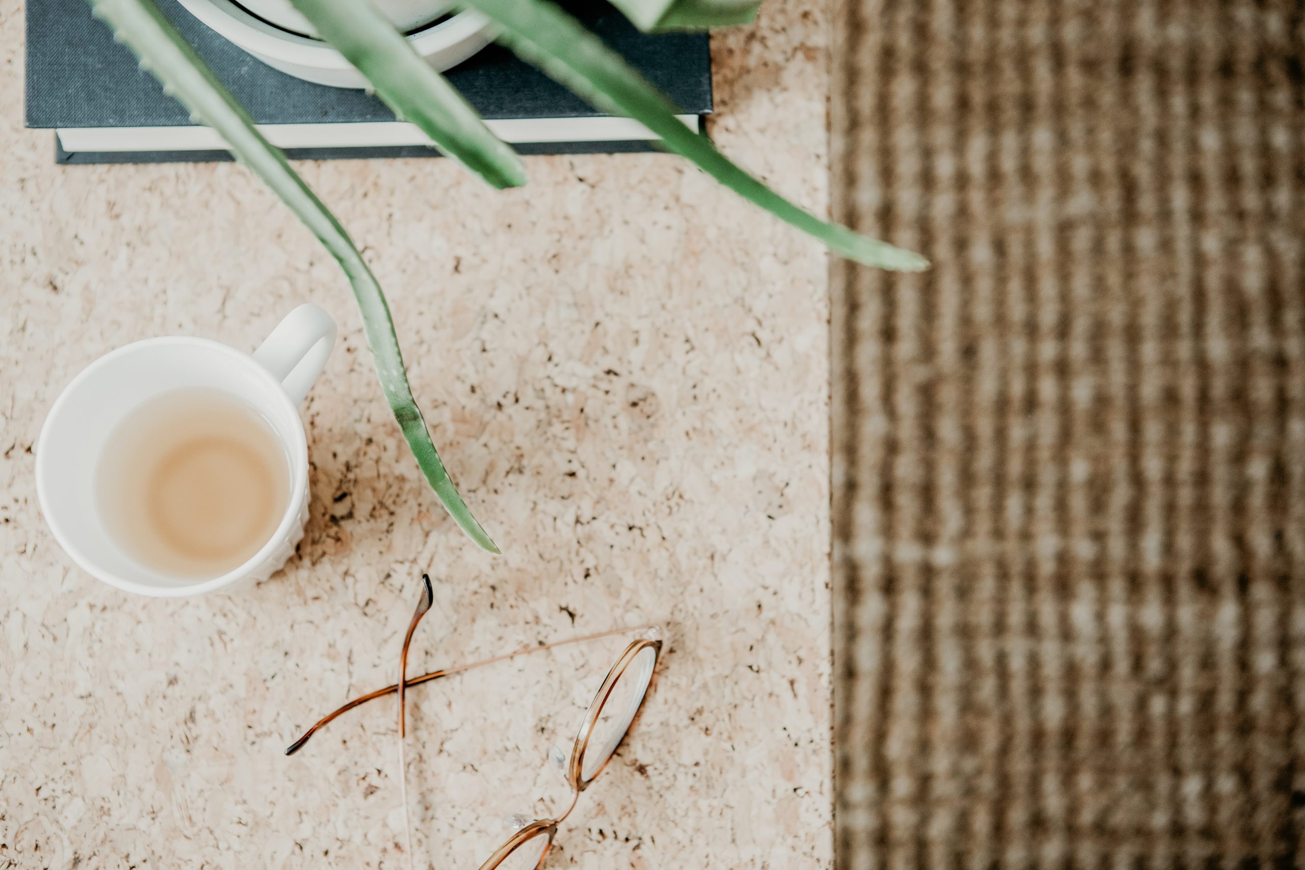 cup of tea, leaves, and glasses 