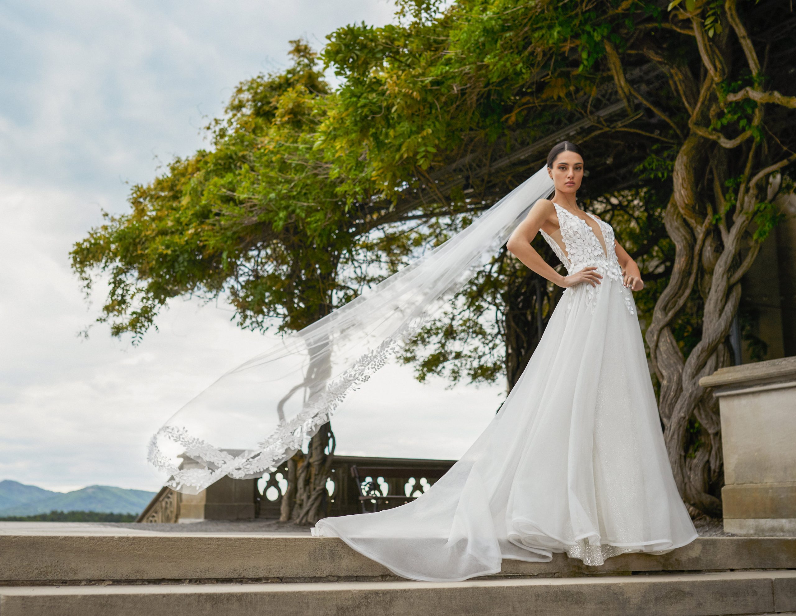 Bride wearing long veil and floor length dress
